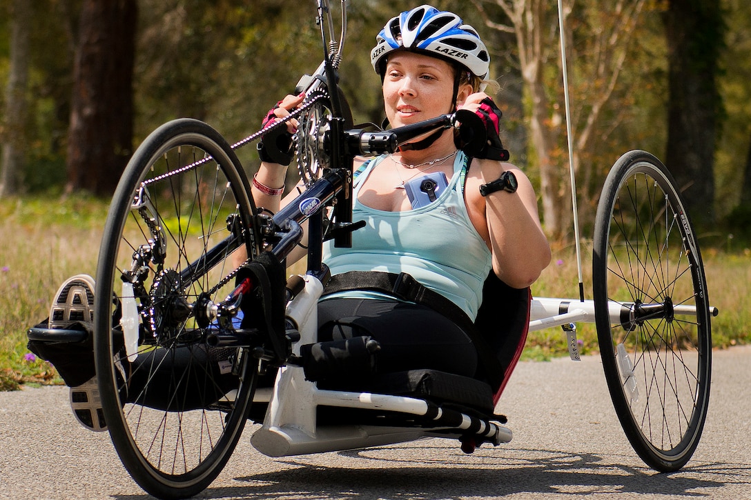 Heather Carter, a Warrior Games athlete, uses a handcycle during a morning cycling session at the adaptive sports camp at Eglin Air Force Base, Fla., April 6, 2016. Air Force photo by Samuel King Jr.