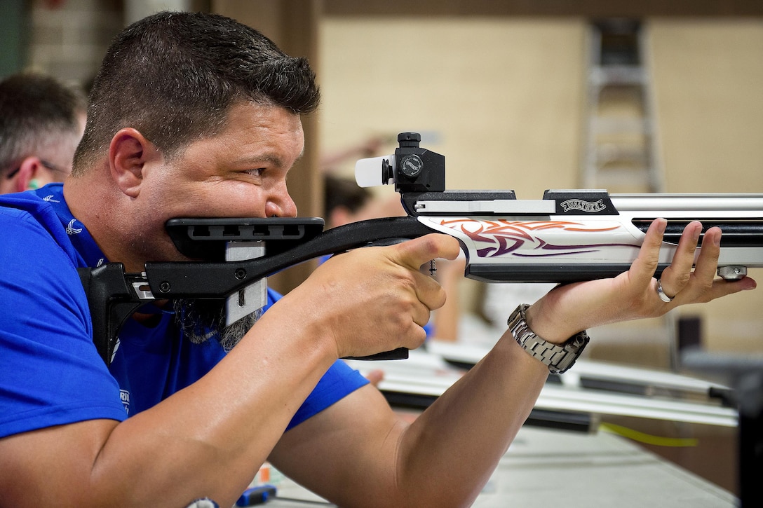 Courtney Hinson, a Warrior Games athlete, aims his rifle downrange during a target shooting session at the adaptive sports camp at Eglin Air Force Base, Fla., April 6, 2016. Air Force photo by Samuel King Jr.