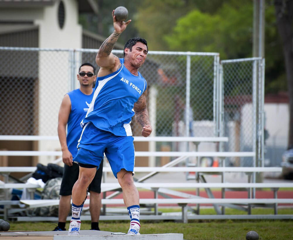 Christopher Ferrell, a Warrior Games athlete, tosses the shot put during an afternoon track and field training session at Eglin Air Force Base, Fla., April 6, 2016. Air Force photo by Samuel King Jr.