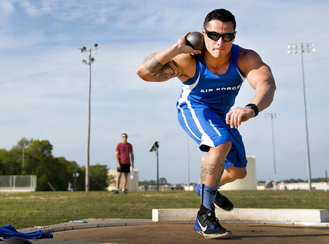 Vince Cavasos, a Warrior Games athlete, prepares to toss the shot put during an afternoon track and field training session at Eglin Air Force Base, Fla., April 6, 2016. Air Force photo by Samuel King Jr.