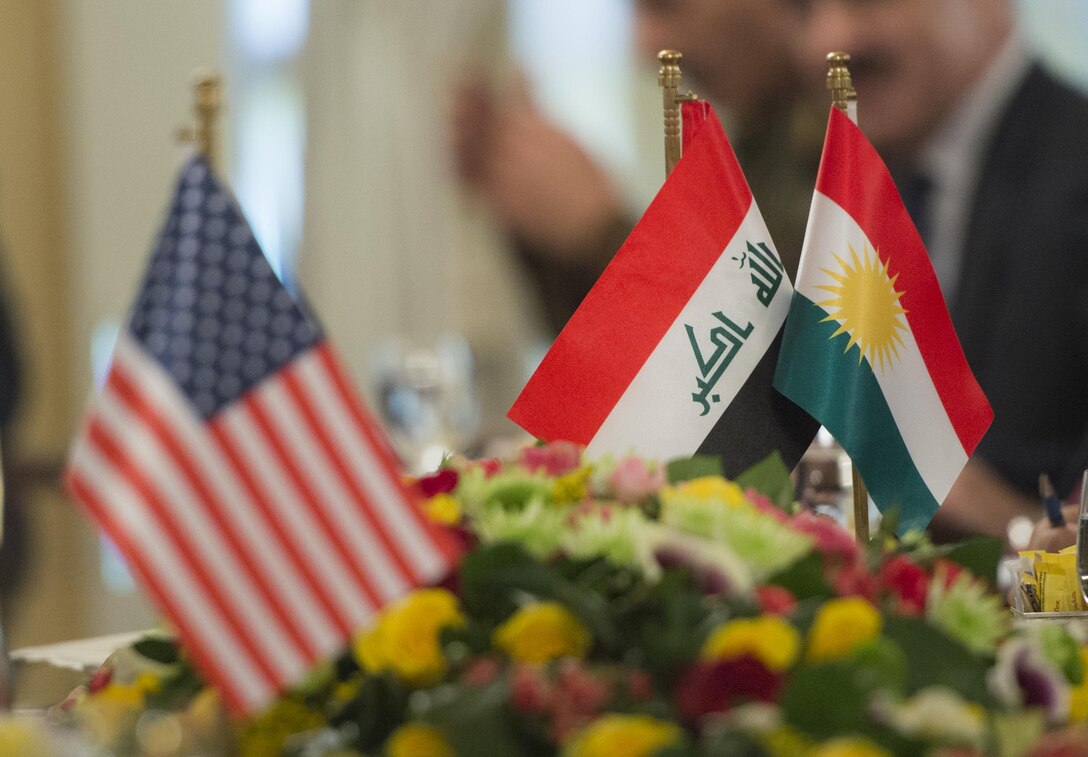 From left, the flags of the United States, Iraq and Iraqi Kurdistan sit on display during a meeting between Marine Corps Gen. Joe Dunford, chairman of the Joint Chiefs of Staff, and Massoud Barzani, president of Iraqi Kurdistan, in Iraq, April 22, 2016. DoD photo by Navy Petty Officer 2nd Class Dominique A. Pineiro
