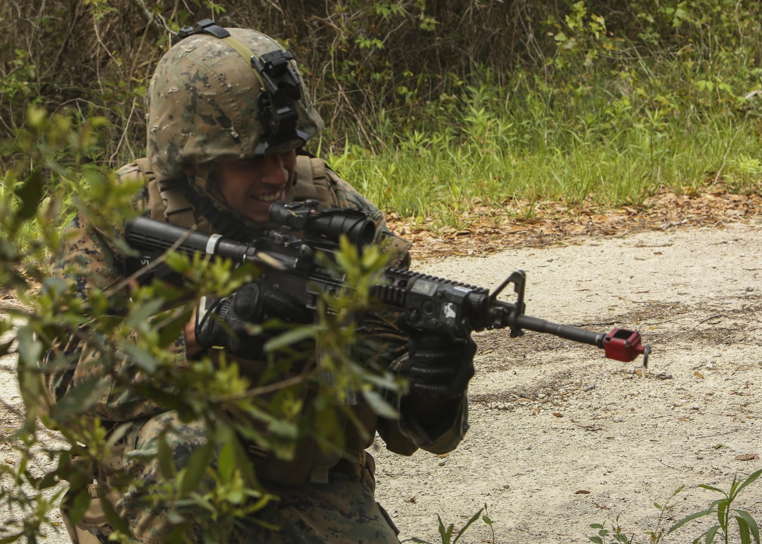 Capt. Daniel Mora, a military police officer with 1st Platoon, Bravo Company, 2nd Law Enforcement Battalion, returns fire on simulated enemy combatants during a perimeter security patrol during the II Marine Expeditionary Force Command Post Exercise 3 at Camp Lejeune, N.C., April 20, 2016. During the CPX, 2nd LEB posted security around the campsite and defended it from mock enemies, ensuring the headquarters element could complete the mission safely. (U.S. Marine Corps photo by Cpl. Michelle Reif/Released)