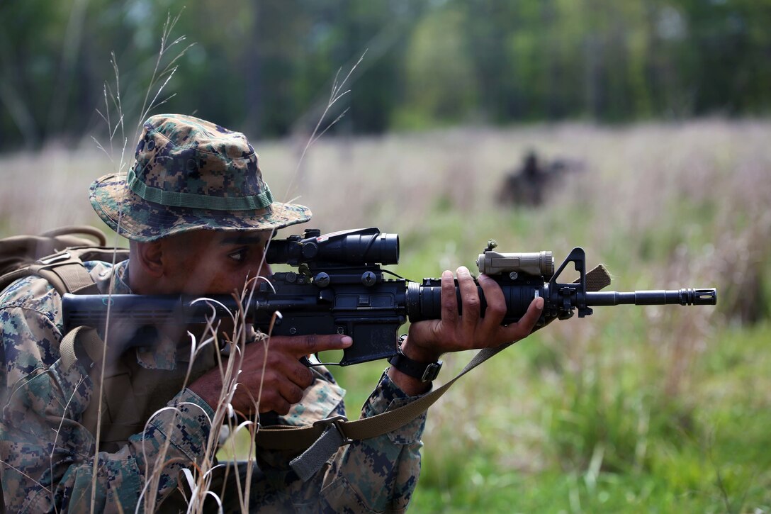 Pfc. Dugan Gilbert, a rifleman with 3rd Battalion, 2nd Marine Regiment, suppresses enemy fire during a training exercise at Camp Lejeune, N.C., April 20, 2016. The unit practiced buddy rushing and squad tactics to maintain readiness and prepare for future deployments. (U.S. Marine Corps photo by Lance Cpl. Brianna Gaudi/Released)
