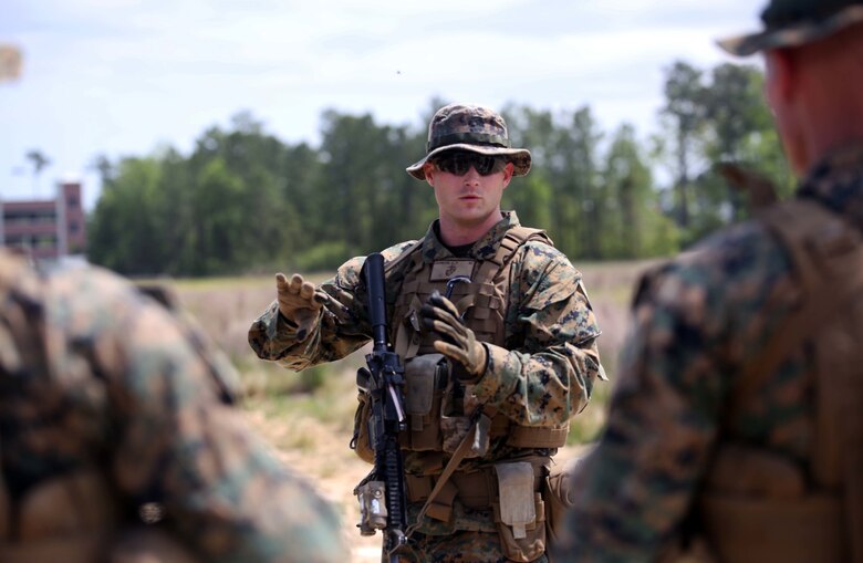 Marines with 3rd Battalion, 2nd Marine Regiment consolidate to review their performance during a training exercise at Camp Lejeune, N.C., April 20, 2016. The unit practiced buddy rushing and squad tactics to maintain readiness and prepare for future deployments. (U.S. Marine Corps photo by Lance Cpl. Brianna Gaudi/Released)