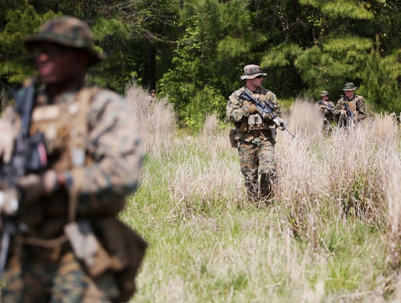 Marines with 3rd Battalion, 2nd Marine Regiment patrol before receiving simulated fire during a training exercise at Camp Lejeune, N.C., April 20, 2016. The unit practiced buddy rushing and squad tactics to maintain readiness and prepare for future deployments. (U.S. Marine Corps photo by Lance Cpl. Brianna Gaudi/Released)