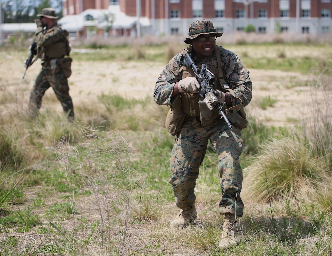 Lance Cpl. Darnell Hamm, a team leader with 3rd Battalion, 2nd Marine Regiment takes immediate action when coming in contact with the enemy during a training exercise at Camp Lejeune, N.C., April 20, 2016. The unit practiced buddy rushing and squad tactics to maintain readiness and prepare for future deployments. (U.S. Marine Corps photo by Lance Cpl. Brianna Gaudi/Released)