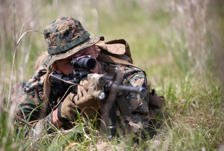 Pfc. Nicholas Frantz, a grenadier with 3rd Battalion, 2nd Marine Regiment, suppresses the enemy during a training exercise at Camp Lejeune, N.C., April 20, 2016. The unit practiced buddy rushing and squad tactics to maintain readiness and prepare for future deployments. (U.S. Marine Corps photo by Lance Cpl. Brianna Gaudi/Released)