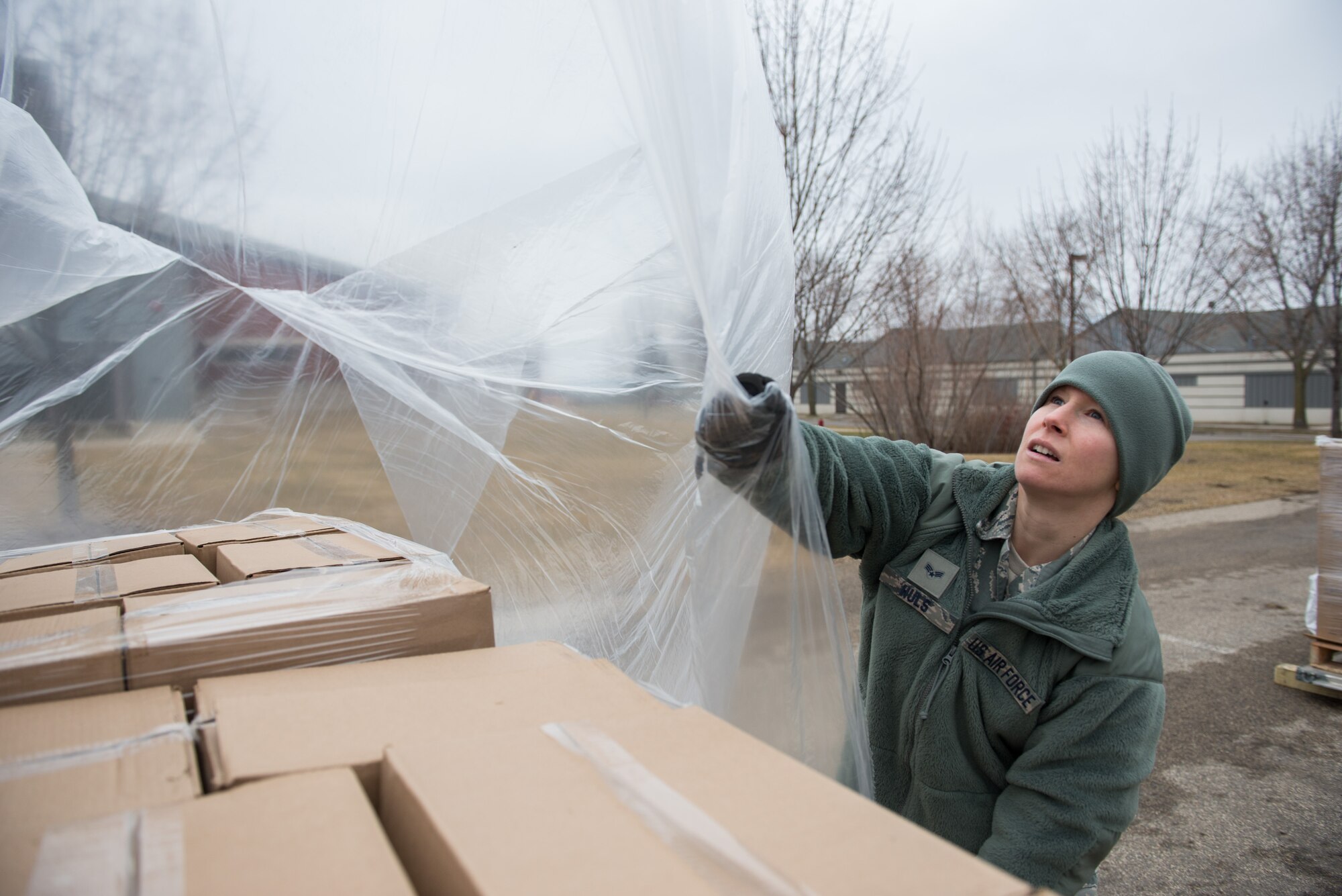 Senior Airman Megan Huls prepares pallets of cargo at the 27th Aerial Port Squadron in support of the humanitarian mission to Afghanistan on 5 March 5. (U.S. Air Force Photo by Staff Sgt. Trevor Saylor)
