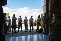 Maintenance workers huddle up for a pre-shift briefing at Aviano AB, Italy, prior to working in support of Exercise Saber Junction. (U.S. Air Force photo by Staff Sgt. Trevor Saylor)