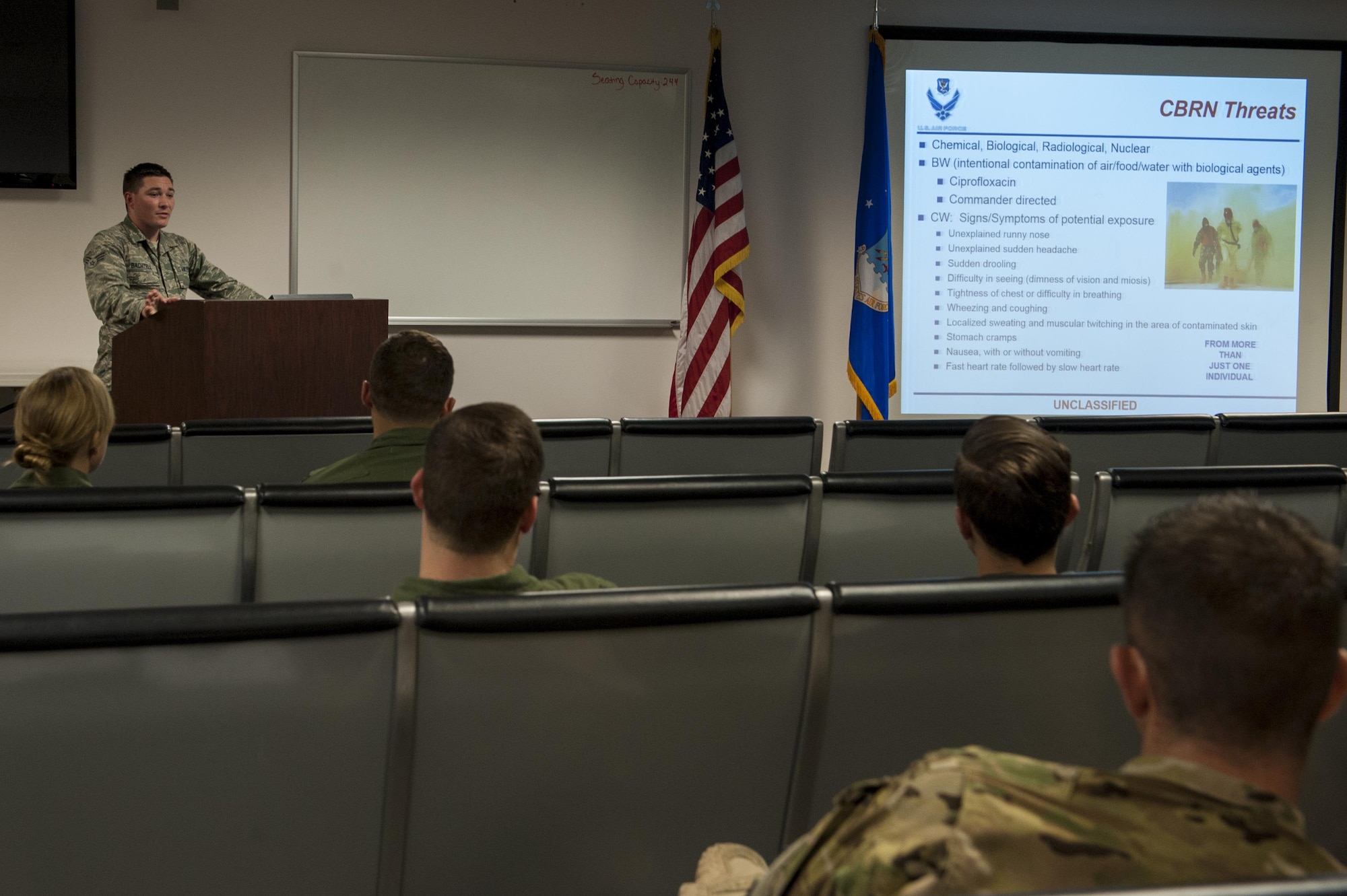 U.S. Air Force Senior Airman Aaron Bachtell, 23d Medical Operations Squadron public health technician, briefs deploying Airmen, April 21, 2016, at Moody Air Force Base, Ga. Bachtell briefed Airmen about how to maintain their health while deployed overseas. (U.S. Air Force photo by Airman 1st Class Lauren M. Hunter/Released)