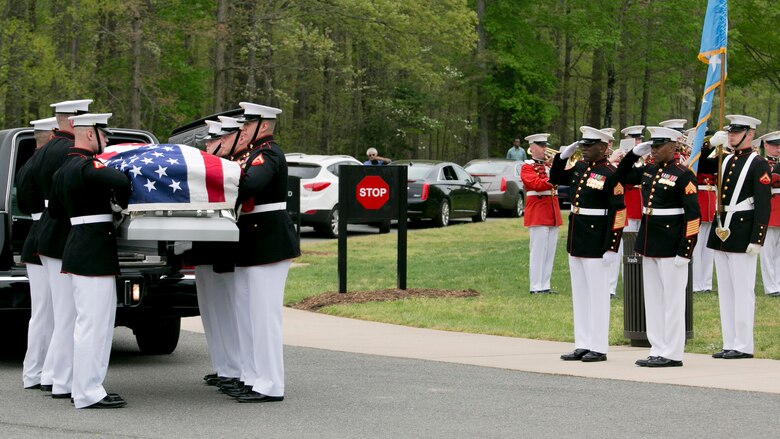 Sgt. Maj.  Ronald L. Green (left), Sergeant Major of the Marine Corps, and Master Gunnery Sgt. Leonard Spain (right), funeral director, Marine Barracks Washington, D.C., render honors as the Body Bearers from Bravo Co. conduct a casket transfer during the funeral for Medal of Honor Recipient, Pfc. Hector A. Cafferata at Quantico National Cemetery, Virginia, April 22, 2016. According to Cafferata's Medal of Honor award citation, on Nov. 28, 1950 while serving as a rifleman with Fox Company, 2nd Battalion, 7th Marines, 1st Marine Division, during the Chosin Reservoir Campaign, Cafferata's fortitude, great personal valor, and dauntless perseverance in the face of almost certain death, saved the lives of several of his fellow Marines and contributed essentially to the success achieved by his company in maintaining its defensive position against tremendous odds. Cafferata passed away, April 12, 2016 at the age of 86.