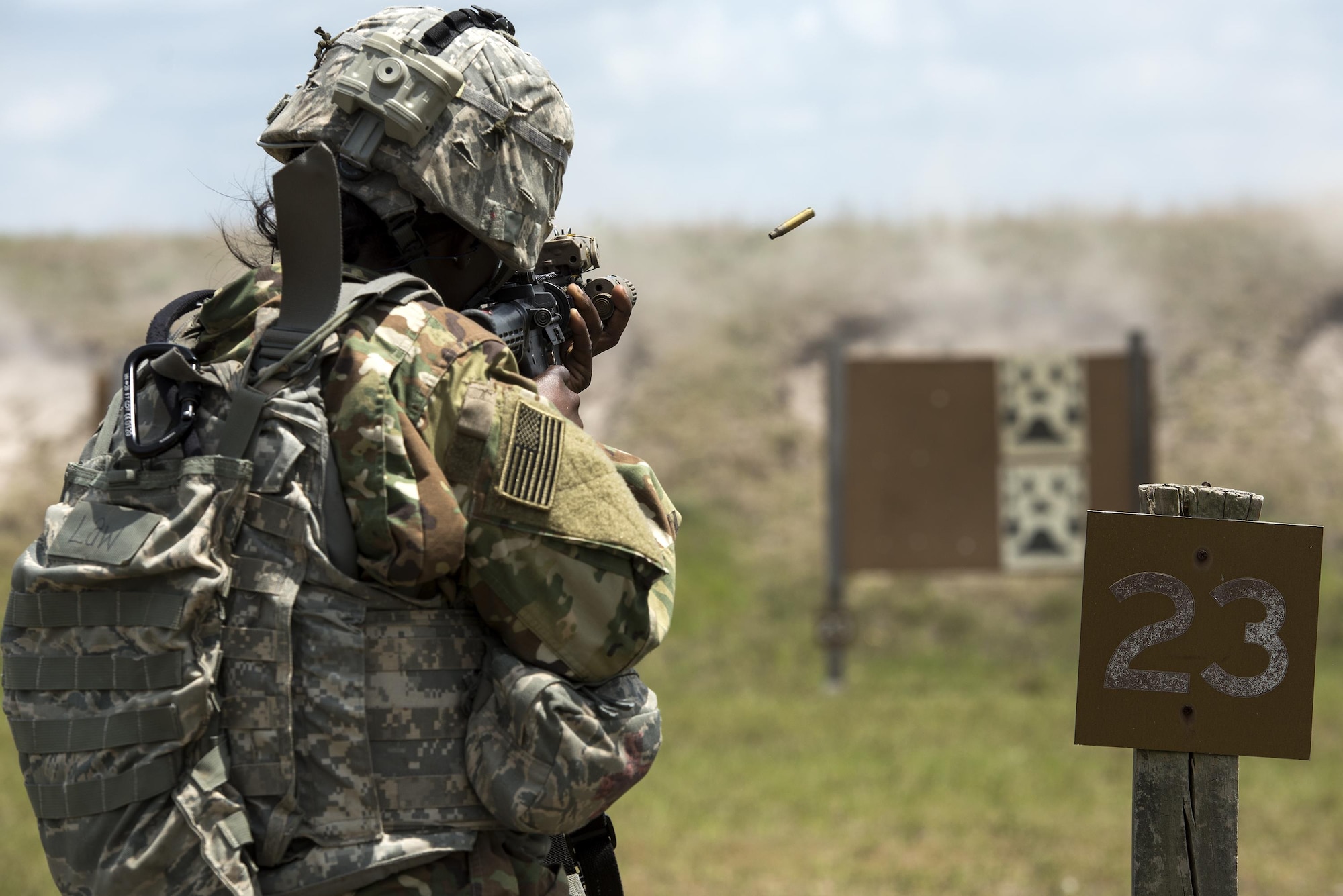 U.S. Air Force Senior Airman Niya Law, 823d Base Defense Squadron fireteam member, fires an M4 carbine April 13, 2016, at Avon Park Air Force Range, Fla. During Spartan Warrior week Airmen assigned to various squadrons across the U.S. competed against one another for medals, bragging rights and a trophy. (U.S. Air Force photo by Airman 1st Class Janiqua P. Robinson/Released)