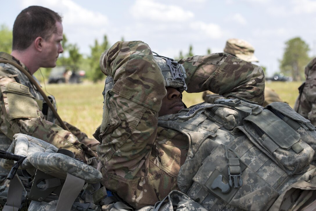 U.S. Air Force Senior Airman Eric Purnell, 823d Base Defense Squadron fireteam member, rests during a waiting period, April 13, 2016, at Avon Park Air Force Range, Fla. Airmen took any opportunity to rest in the shade and take a quick nap before moving to the next challenge. (U.S. Air Force photo by Airman 1st Class Janiqua P. Robinson/Released)