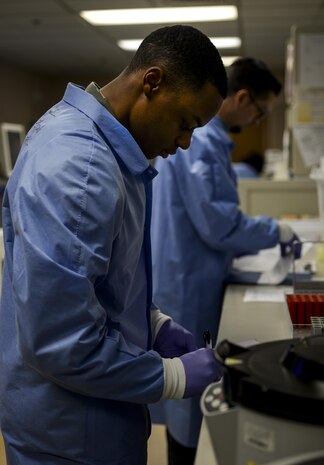 Airman 1st Class Chad Hall, 99th Medical Group medical laboratory phase II student, uses a centrifuge to test samples from patients across the Mike O'Callaghan Federal Medical Center at Nellis Air Force Base, Nev., April 15, 2016. The 99th Medical Support Squadron ensures maximum wartime readiness in support of the largest and most diverse bases in Air Combat Command. (U.S. Air Force photo by Airman 1st Class Kevin Tanenbaum)