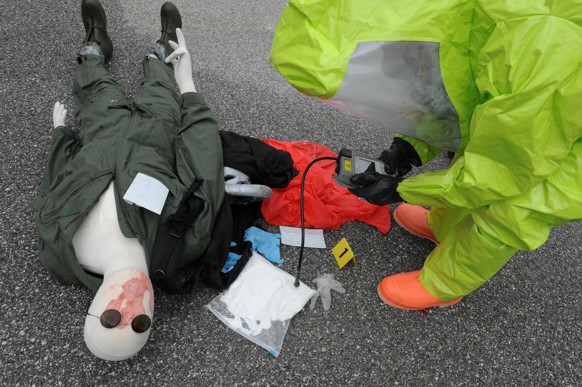 Roger Schwartz, Base Operations Support Emergency Management operations specialist, analyzes the suspected product to identify an unknown substance during a Chemical, Biological, Radiological, Nuclear and Explosive exercise scenario, April 21, 2016, Keesler Air Force Base, Miss. The Force Protection Condition exercise scenario simulated an intruder entering the hazardous waste 90-day accumulation site, where an explosion occurred causing a mass casualty event. The exercise tested the base’s capability to react to and recover from a mass casualty event. (U.S. Air Force photo by Kemberly Groue)