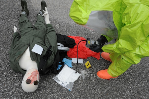Roger Schwartz, Base Operations Support Emergency Management operations specialist, analyzes the suspected product to identify an unknown substance during a Chemical, Biological, Radiological, Nuclear and Explosive exercise scenario, April 21, 2016, Keesler Air Force Base, Miss. The Force Protection Condition exercise scenario simulated an intruder entering the hazardous waste 90-day accumulation site, where an explosion occurred causing a mass casualty event. The exercise tested the base’s capability to react to and recover from a mass casualty event. (U.S. Air Force photo by Kemberly Groue)