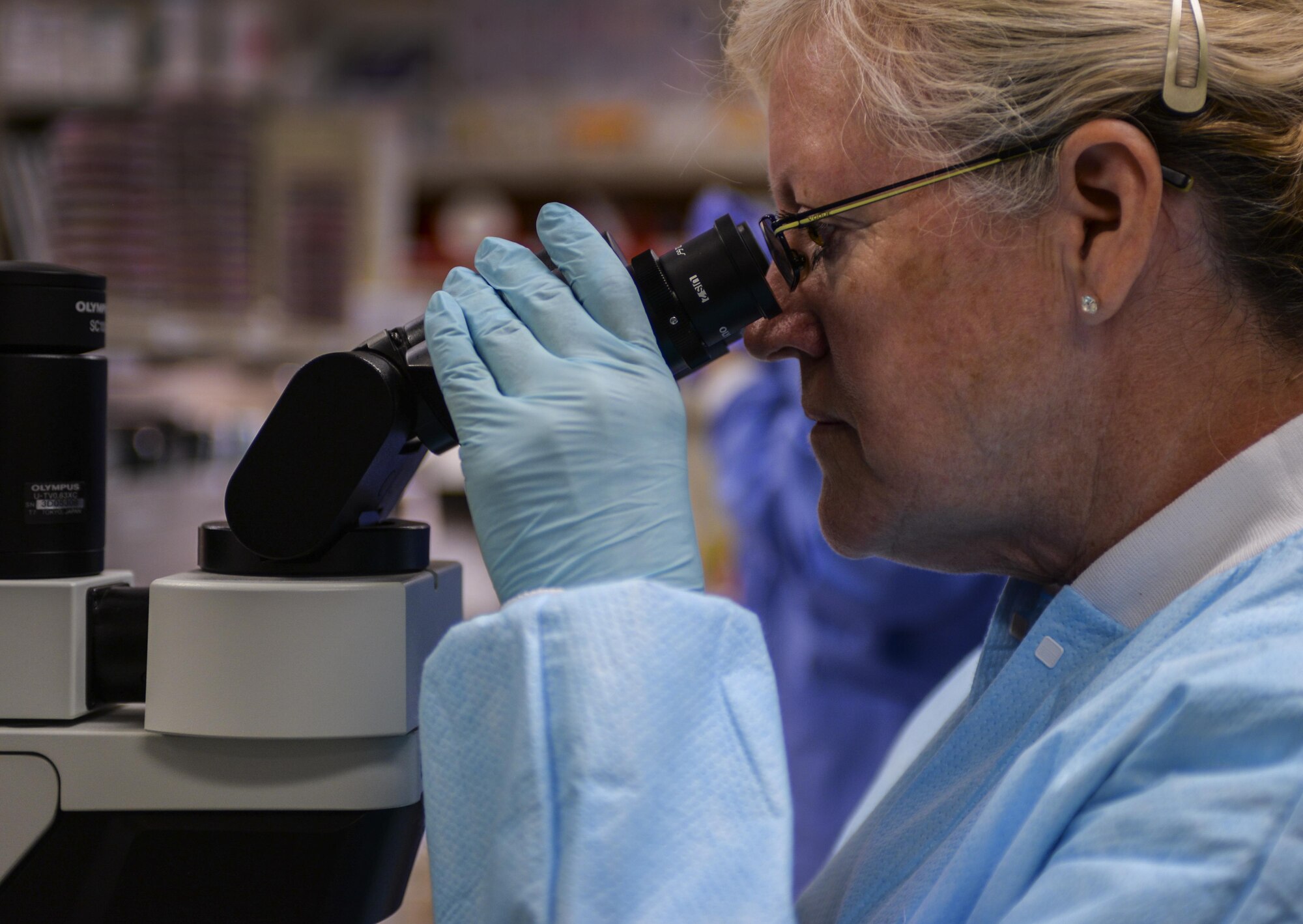 Ruth Jones, 99th Medical Support Squadron medical technologist, looks through a microscope in the microbiology department of the Laboratory at the Mike O’Callaghan Federal Medical Center at Nellis Air Force Base, Nev., on April 15, 2016. The Microbiology section of the lab tests patients for infections caused by bacteria, fungi or parasites. Many types of specimens including blood, urine, stool and others are tested. 