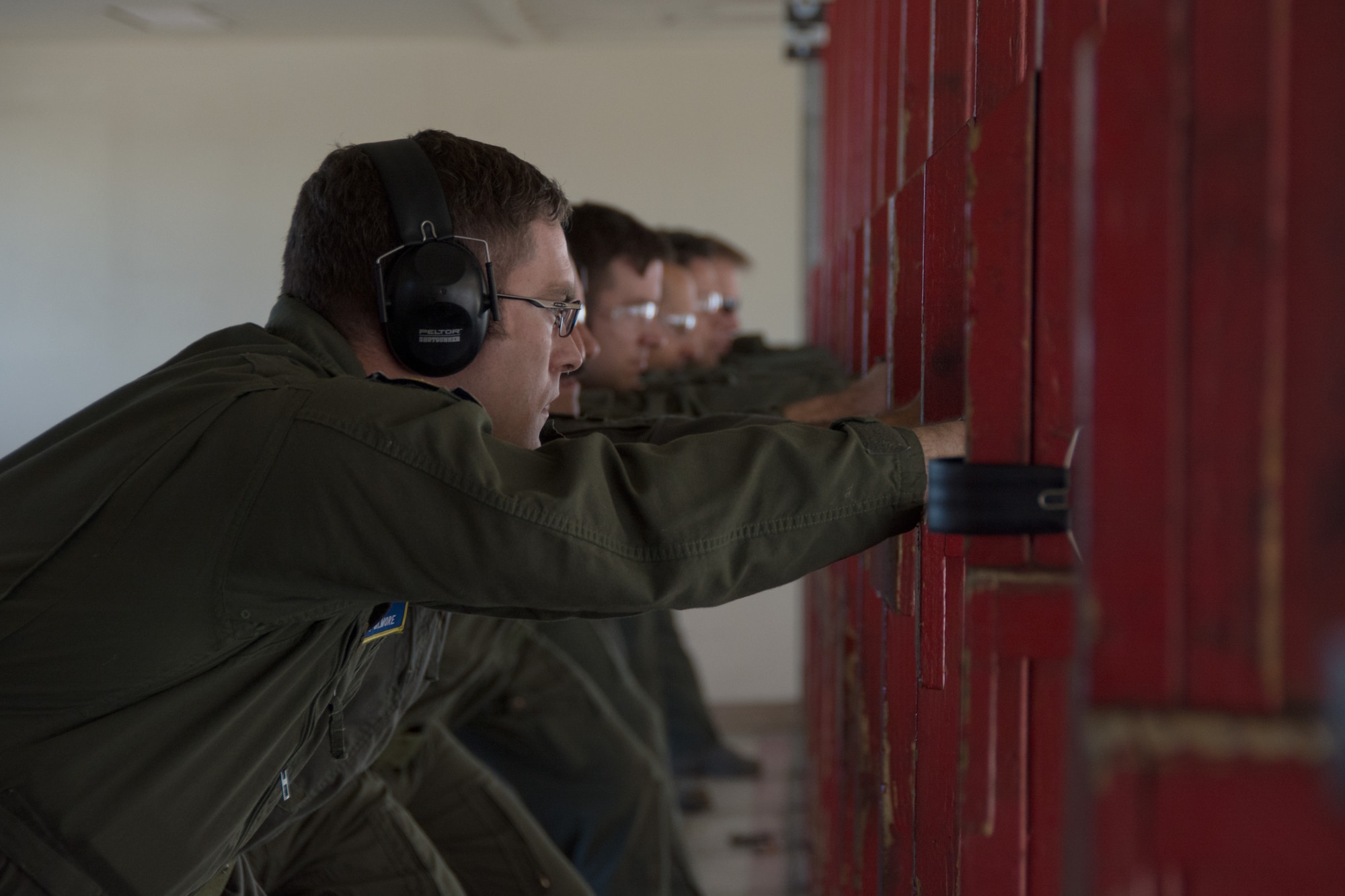 An airman prepares to fire his weapon during an M9 qualifications course at the 349th Security Forces Squadron Combat Arms Training range on Apr. 17, 2016 at Travis Air Force Base, Calif. The course consisted of aircrew members from the 70th Air Refueling Squadron, 79th ARS, 301st Airlift Squadron and the 312th AS.  (U.S. Air Force photo/Airman 1st Class Shelby R. Horn)