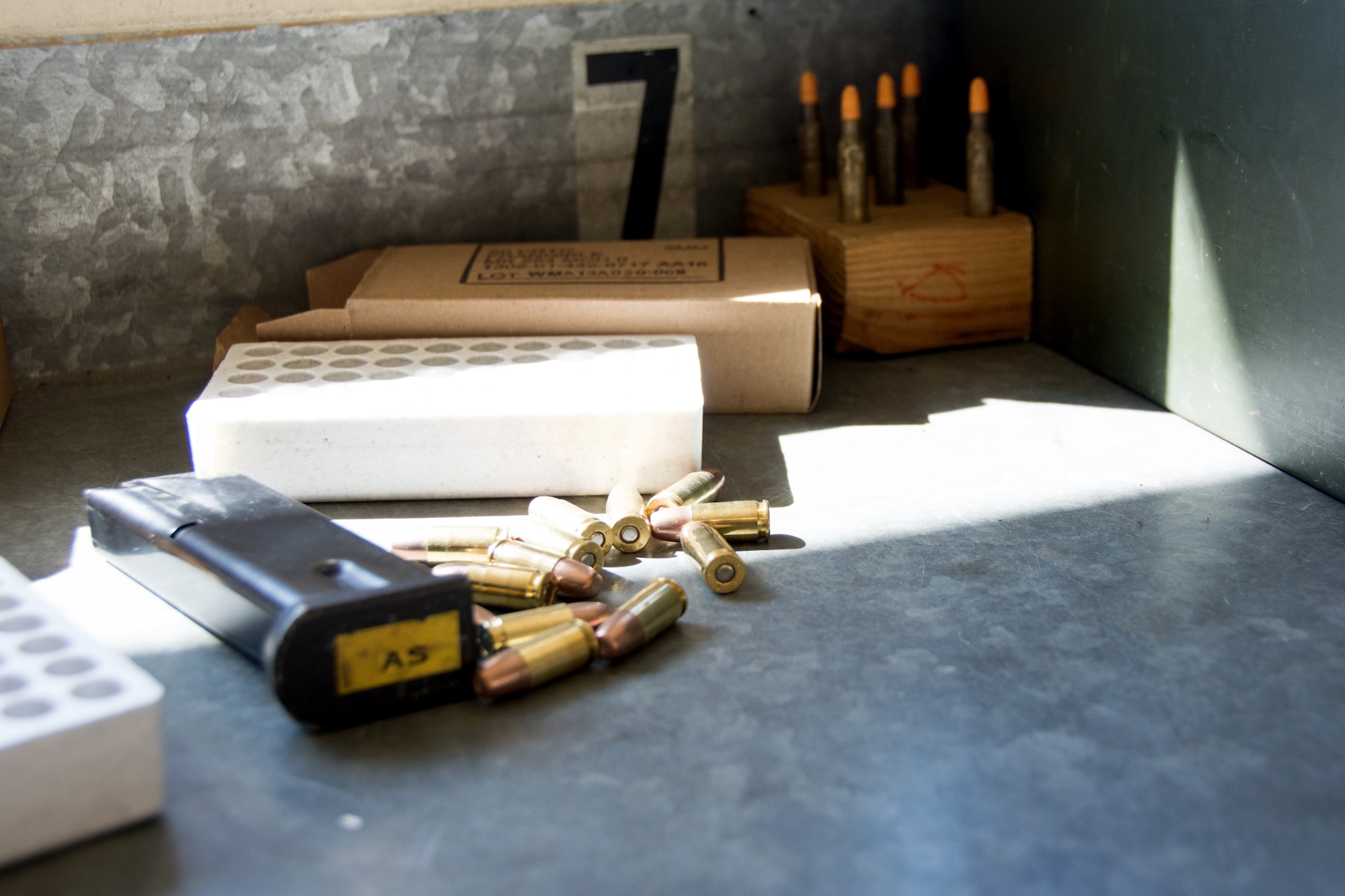 A magazine and 9 millimeter rounds sit ready for loading at the 349th Security Forces Squadron Combat Arms Training range on Apr. 17, 2016 at Travis Air Force Base, Calif. While participating in an M9 qualification course airmen must load and unload their own ammunition according directions given by the combat arms instructors. (U.S. Air Force photo/Airman 1st Class Shelby R. Horn)