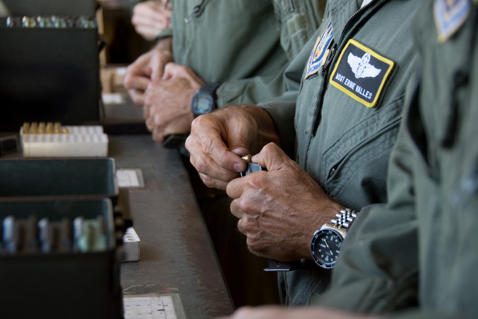 An airman loads his M9 magazine with ammunition prior to firing during an M9 qualifications course at the 349th Security Forces Squadron Combat Arms Training range on Apr. 17, 2016 at Travis Air Force Base, Calif. If an airman runs out of ammunition while firing, he is able to take a knee and reload a fresh magazine into the weapon. (U.S. Air Force photo/Airman 1st Class Shelby R. Horn)