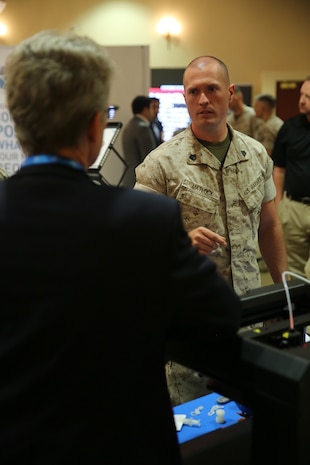 MARINE CORPS BASE CAMP PENDLETON, Calif. – Sgt. David Matlock learns about a 3-D laser printer at the Pacific Views Events Center during the “Tactical & Technology Day” on Camp Pendleton April 20, 2016.  More than 20 companies from around the country attended the event where they showcased their current and future technologies and received user feedback. Matlock is a radio technician with 3rd Assault Amphibian Battalion, 1st Marine Division, and is a Calhoun, Ga. native. (U.S. Marine Corps photo by Lance Cpl. Shellie Hall/ Not Released)