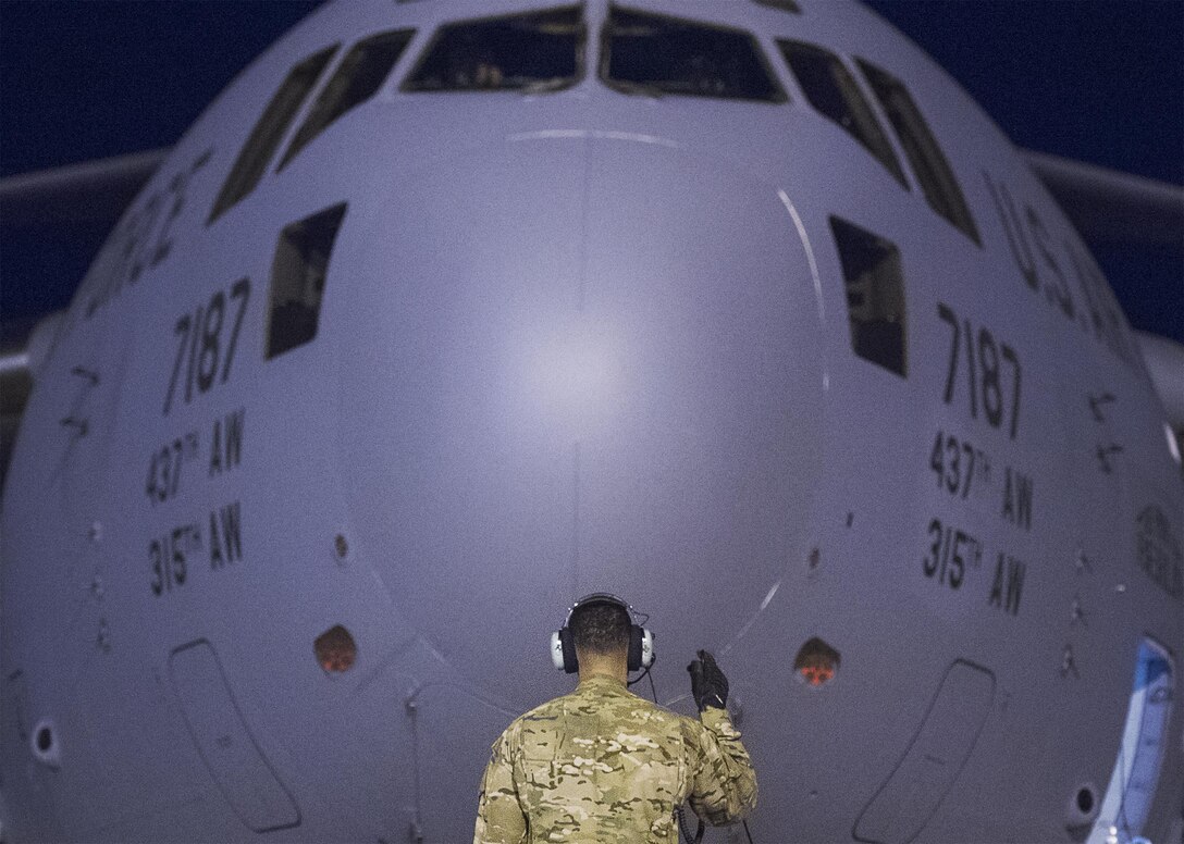 An Air Force crew chief prepares a C-17 that will transport Marine Corps Gen. Joe Dunford, chairman of the Joint Chiefs of Staff, on his departure from Iraq’s Kurdistan region, April 22, 2016. Dunford visited Iraq to assess the campaign against the Islamic State of Iraq and the Levant. DoD photo by Navy Petty Officer 2nd Class Dominique A. Pineiro