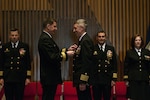 BANGOR, Wash. (April 20, 2016) " Capt. Michael Lewis, from Bend, Oregon, receives the Legion of Merit medal from Rear Adm. David Kriete, commander, Submarine Group Nine, during a change of command ceremony for the Gold Crew of the guided-missile submarine USS Ohio (SSGN 726). During the ceremony, held at the Bangor Chapel, Lewis turned over command to Capt. Gerald Miranda, from San Diego, California. (U.S. Navy photo by Mass Communication Specialist 2nd Class Amanda R. Gray/Released)