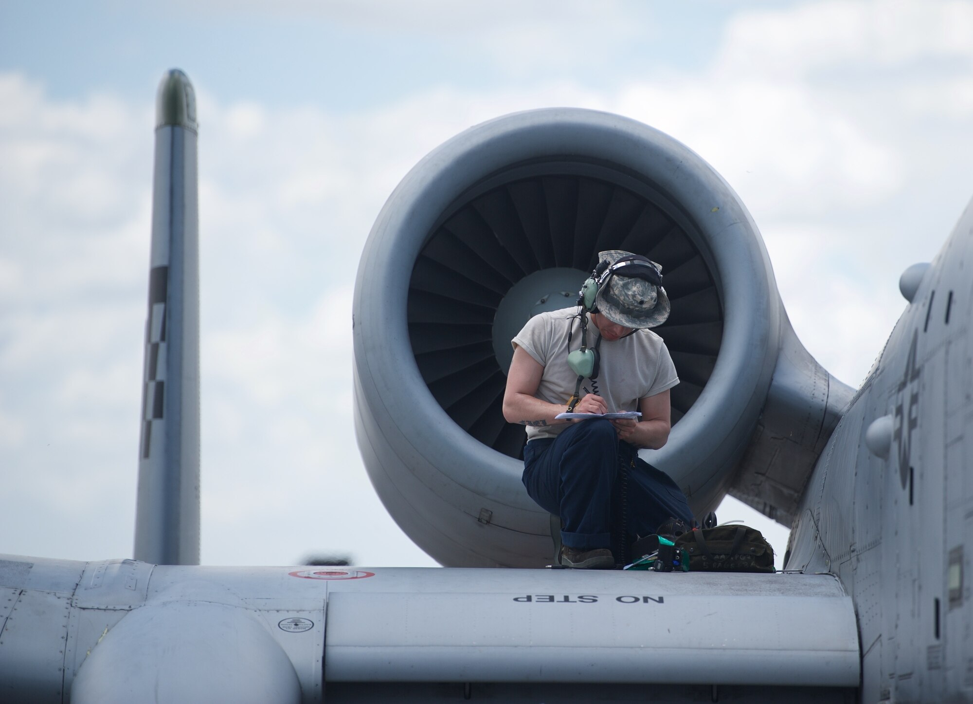U.S. Air Force Senior Airman Peter Espinoza, A-10C Thunderbolt II crew chief, deployed from Osan Air Base, Republic of Korea, goes through a checklist for an A-10C after the aircraft conducted an air and maritime domain awareness mission intended to provide more transparent air and maritime situational awareness ensuring safety for military and civilian activities in international waters April 21, 2016, at Clark Air Base, Philippines. The aircraft’s parts are interchangeable left and right, including the engines, main landing gear and vertical stabilizers, thus the aircrew and maintainers can deploy with minimal equipment and still ensure the jets are ready to fly at a moment’s notice. (U.S. Air Force photo by Capt. Susan Harrington)