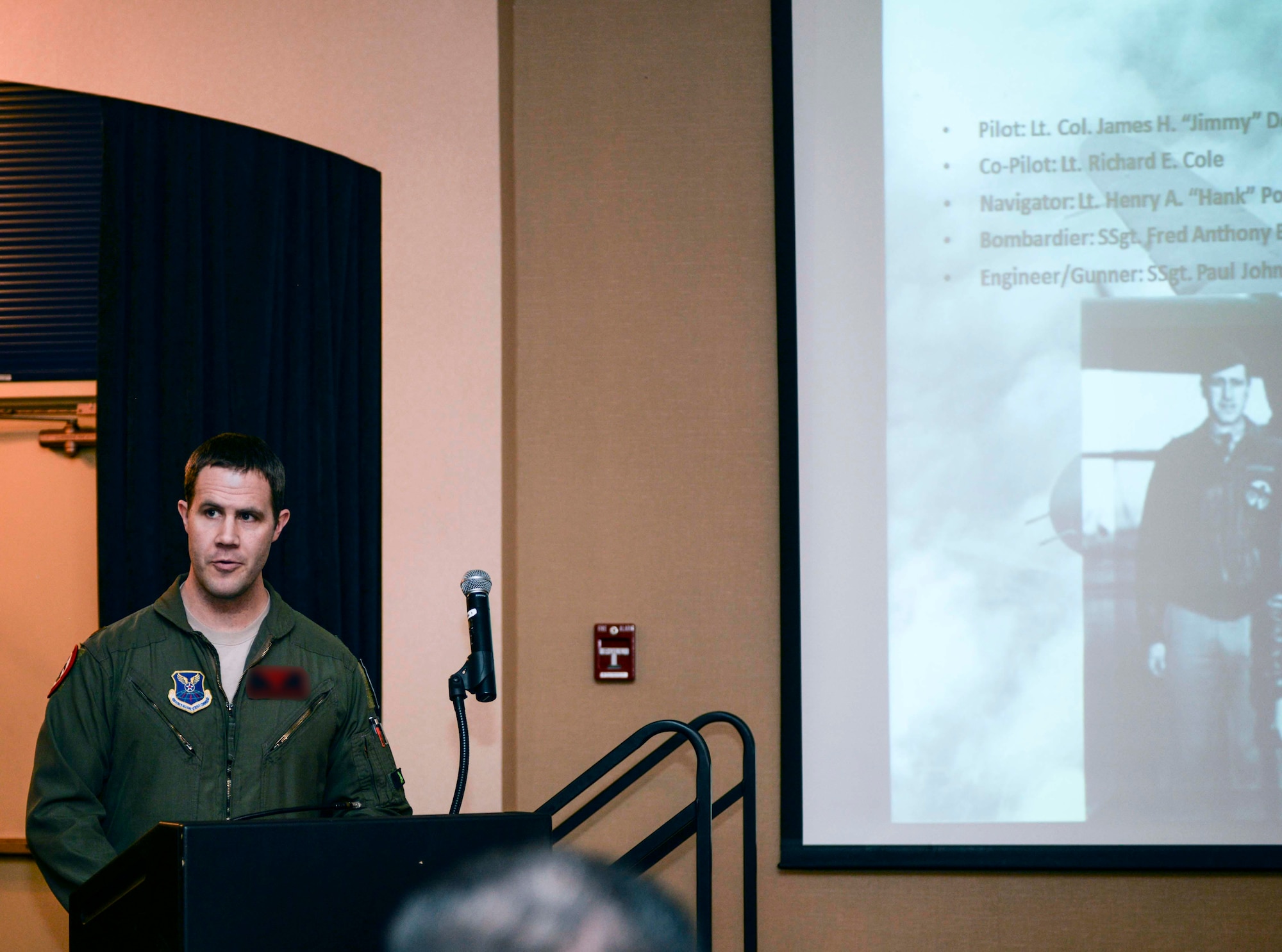 Maj. Brian, 34th Bomb Squadron assistant director of operation instructor pilot, speaks about the first crew of the Doolittle Raid during the Doolittle Raider toast ceremony at Ellsworth Air Force Base, S.D., April 18, 2016. Lt. Col. James Doolittle launched 16 B-25 aircraft for the Doolittle Raid, leading 80 pilots who were the first to fly bomber aircraft from a carrier deck, USS Hornet, and led to the first victory of World War II. (U.S. Air Force photo by Airman 1st Class Sadie Colbert/Released)