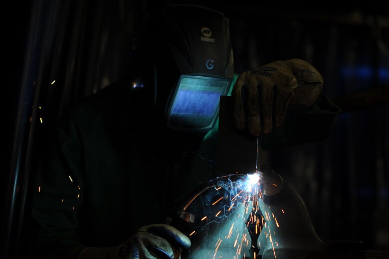 Airman 1st Class Jacob McQueen, 22nd Logistic Readiness Squadron fire and refueler truck mechanic, creates a vertical t weld, April 20, 2016, at McConnell Air Force Base, Kan. Out of the four categories, Mcqueen won the Airman category during the 2016 Welding Competition. (U.S. Air Force photo/Airman Jenna K. Caldwell)   