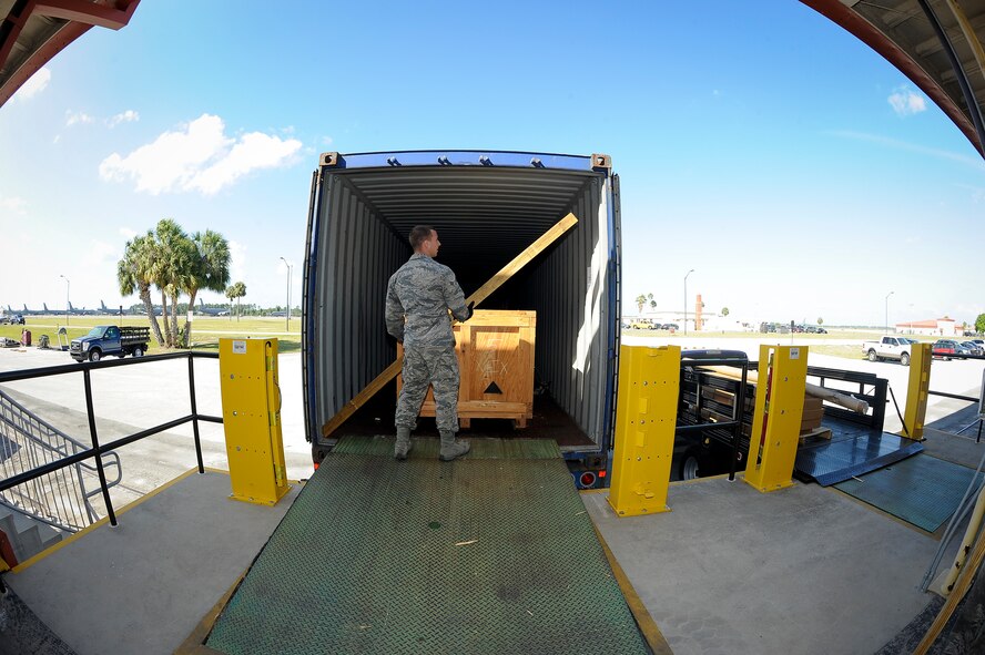 Airman 1st Class William West, a traffic management journeyman with the 6th Logistics 
Readiness Squadron, secures wood bars to a container at MacDill Air Force Base, Fla., April 21, 2016. In the past few months, a total of 53 war reserve materiel crates were transported from MacDill Air Force Base, Florida, throughout the world. (U.S. Air Force photo by Airman 1st Class Mariette Adams)

