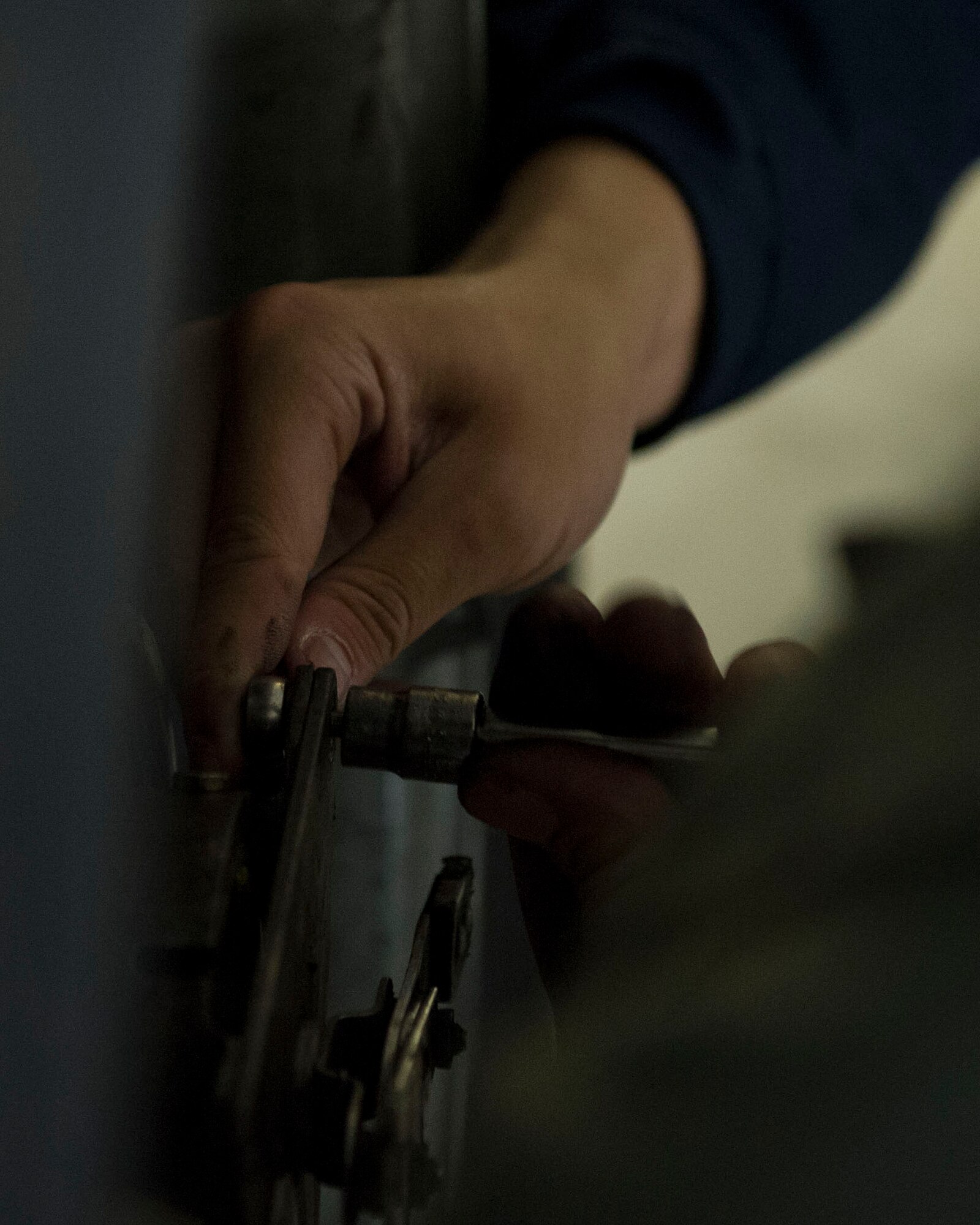 Airman 1st Class Derek Chau, 92nd Maintenance Squadron aerospace propulsion journeyman, loosens a bolt during the bases first KC-135 Stratotanker tire changing competition April 22, 2016, at Fairchild Air Force Base, Wash.  Approximately 20 Airmen from about seven different career fields participated. (U.S. Air Force photo/Airman 1st Class Nick J. Daniello)