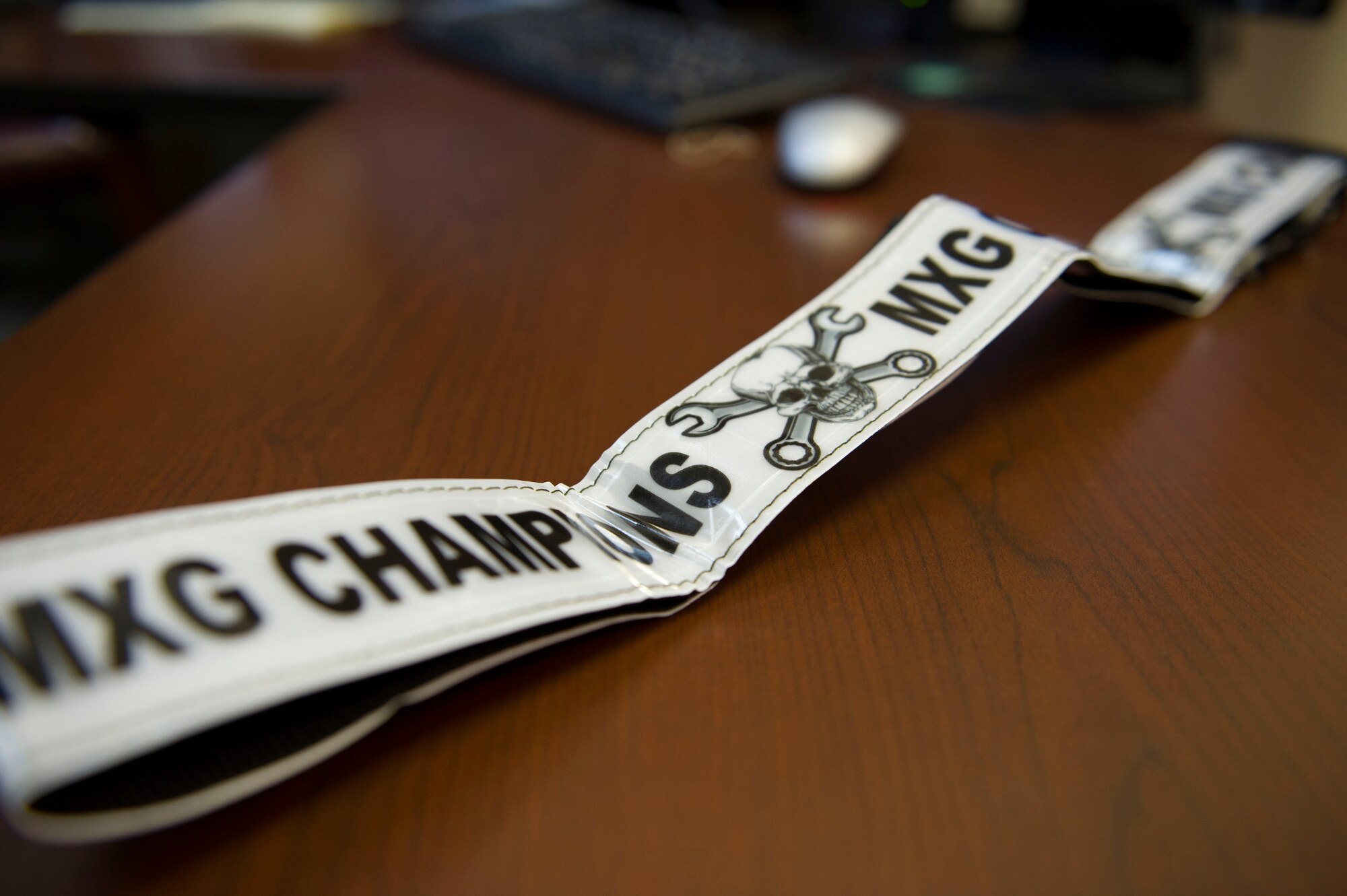 A reflective belt sits on a table April 22, 2016, at Fairchild Air Force Base, Wash. The belts were bestowed to the winners of the 92nd Maintenance Group’s first tire changing competition. The team with the fastest time and least amount of penalties were declared the winners. (U.S. Air Force photo/Airman 1st Class Nick J. Daniello) 