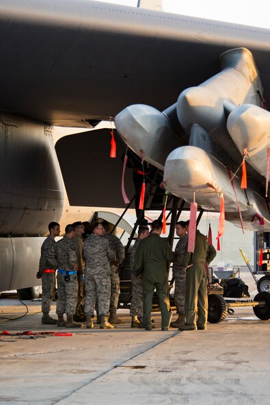 Maj. Gen. Richard Clark, 8th Air Force commander, stands under AGM-86B cruise missiles attached to a B-52H Stratofortress at Minot Air Force Base, N.D., April 12, 2016 during Exercise Constant Vigilance.  Constant Vigilance is an annual Air Force Global Strike Command exercise designed to train and test the command’s ability to perform its mission. (U.S. Air Force photo/Airman 1st Class J.T. Armstrong)