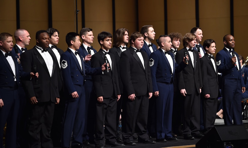 Members of the U.S. Air Force Singing Sergeants, perform along with members of the Russellville High School choir during a U.S. Air Force Concert Band and Singing Sergeants performance at Russellville High School, in Russellville, Ark., April 5, 2016. The band worked with roughly 1,000 students from 14 schools across five states on the tour as part of the Advancing Innovation through Music program. (U.S. Air Force photo by Senior Airman Dylan Nuckolls/Released)