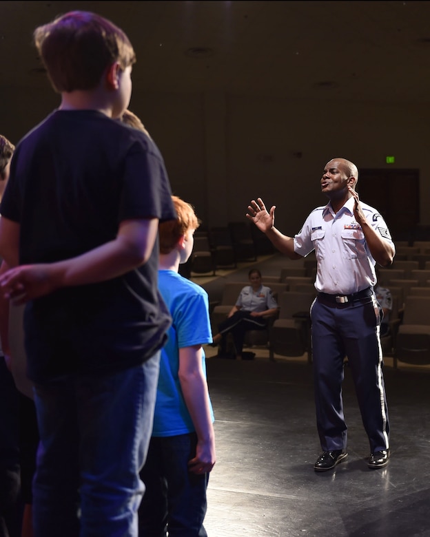 Tech. Sgt. Aaron Paige, U.S. Air Force Singing Sergeants tenor vocalist, speaks to choir students at Star City High School, in Star City, Ark., April 4, 2016. The band worked with roughly 1,000 students from 14 schools across five states on the tour as part of the Advancing Innovation through Music program. (U.S. Air Force photo by Senior Airman Dylan Nuckolls/Released) 
