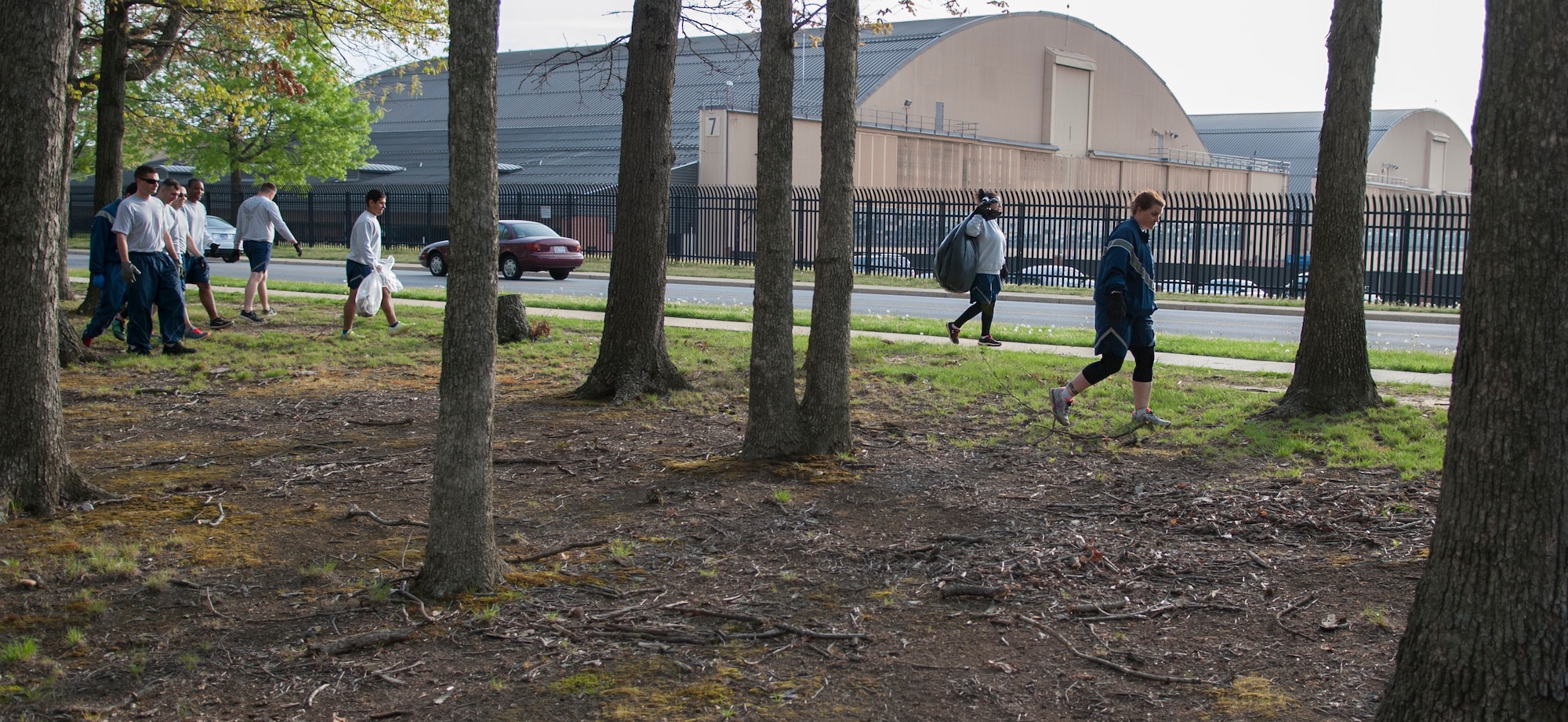 744th Communications Squadron Airmen pick up trash on Joint Base Andrews, Md., April 22, 2016. The Airmen assisted with the base-wide clean up in commemoration of Earth Day. (U.S. Air Force photo by Airman Gabrielle Spalding/Released)