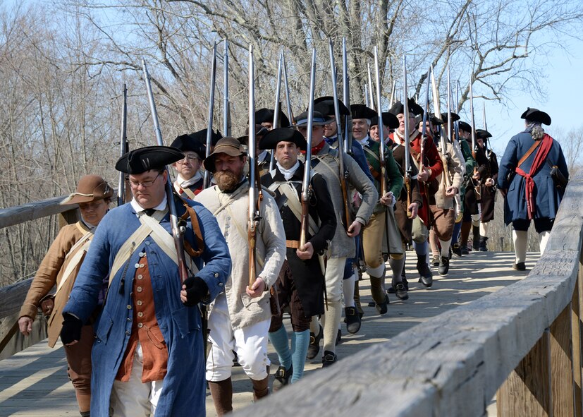 Colonial reenactors commemorate the Shot heard round the world with a staging of the North Bridge fight April 18 in Concord, Mass. Each year in mid-April, thousands of people flock to historic Lexington and Concord and Minute Man National Historical Park to celebrate Patriots' Day. Patriots' Day is a special Massachusetts State holiday commemorating the opening battle of the American Revolutionary War, April 19, 1775. (U.S. Air Force photo by Linda LaBonte Britt)