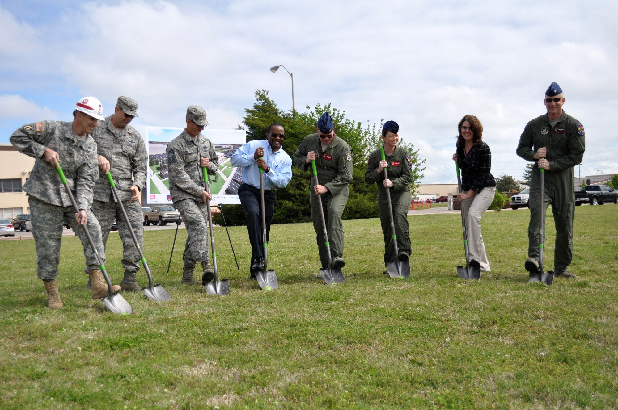 Officials from Tinker Air Force Base, Air Force Reserve, Fortis Networks Inc. and the U.S. Army Corps of Engineers break ground for the future 513th Air Control Group operations building here during a ceremony April 14. Pictured left to right are Col. Richard Pratt, Army Corps of Engineers, Tulsa District commander; Col. Bradley Bird, 552nd Air Control Wing vice commander; Chief Master Sgt. Jeffrey Davis, 513th Air Control Group command chief; Clarence McAllister, Fortis Networks Inc.; Col. David Robertson, 513th Air Control Group commander; Lt. Col. Jennifer Cress, 513th Operations Support Squadron commander; Cathy Scheirman, 72nd Air Base Wing Civil Engineer Directorate chief and Lt. Col. Jim Mattey, 970th Airborne Air Control Squadron director of operations. (Air Force photo by Hannah Lovelace)