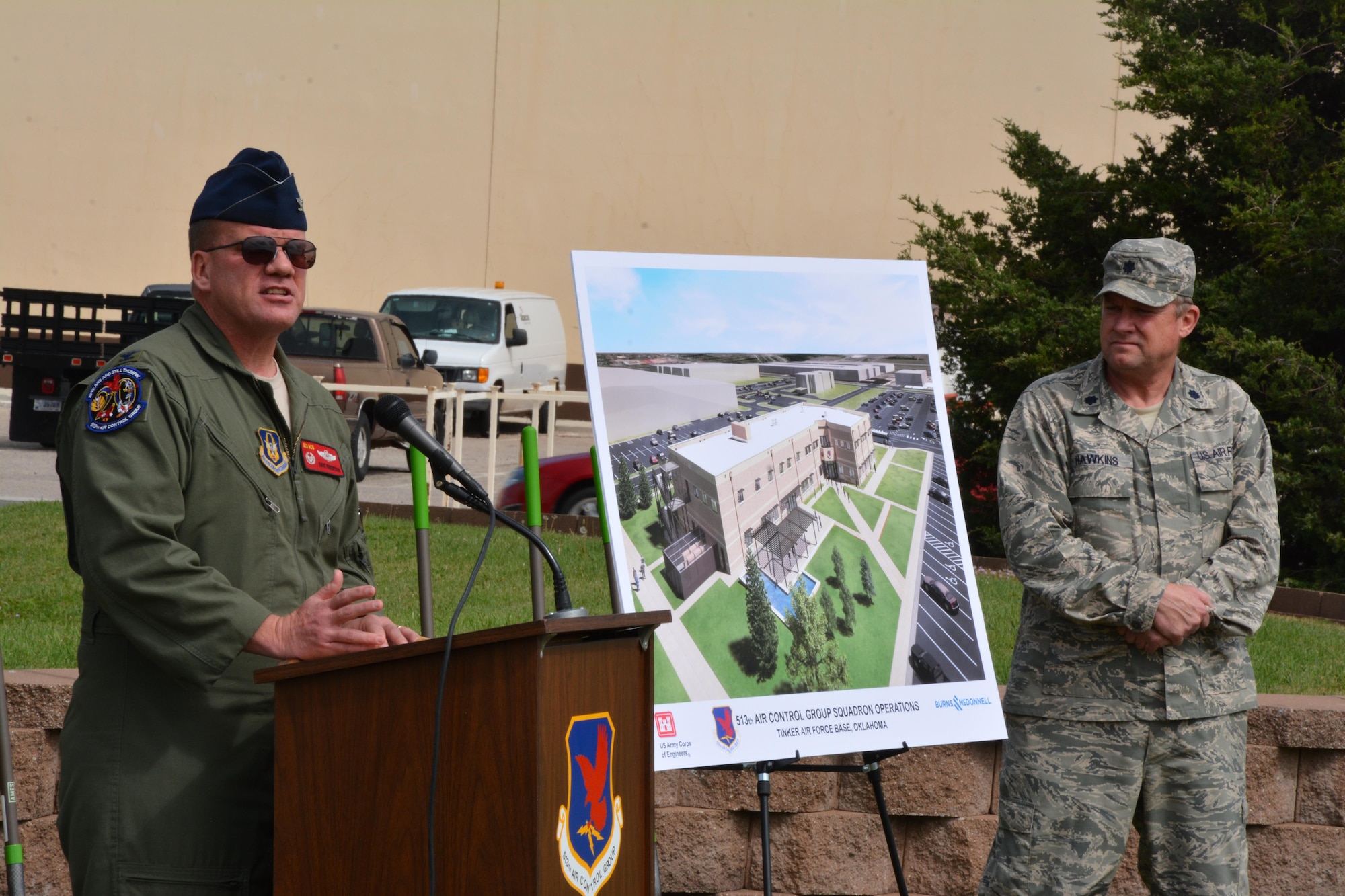 Col. David Robertson, commander of the 513th Air Control Group, delivers a speech during the groundbreaking ceremony for the new operations facility April 14. The 513th ACG is an associate Reserve unit, which augments the 552nd with crews and maintenance personnel for the E-3 Sentry, Airborne Warning and Control System. Looking on is Lt. Col. Ralph Hawkins, 513th ACG executive officer. (Air Force photo by Maj. Jon Quinlan)