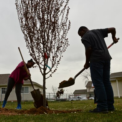 Children from the Hill Force Base Youth Center plant a flowering plum tree April 22 in the base housing area. The base planted four trees in the housing area in conjunction with Earth Day.  Earth Day, which takes place annually on April 22, serves as a day to demonstrate support for environmental protection. For Earth Day 2016, the Air Force is highlighting its commitment to cleaner, greener installations with an emphasis on energy and water conservation. (U.S. Air Force photo by Paul Holcomb) 