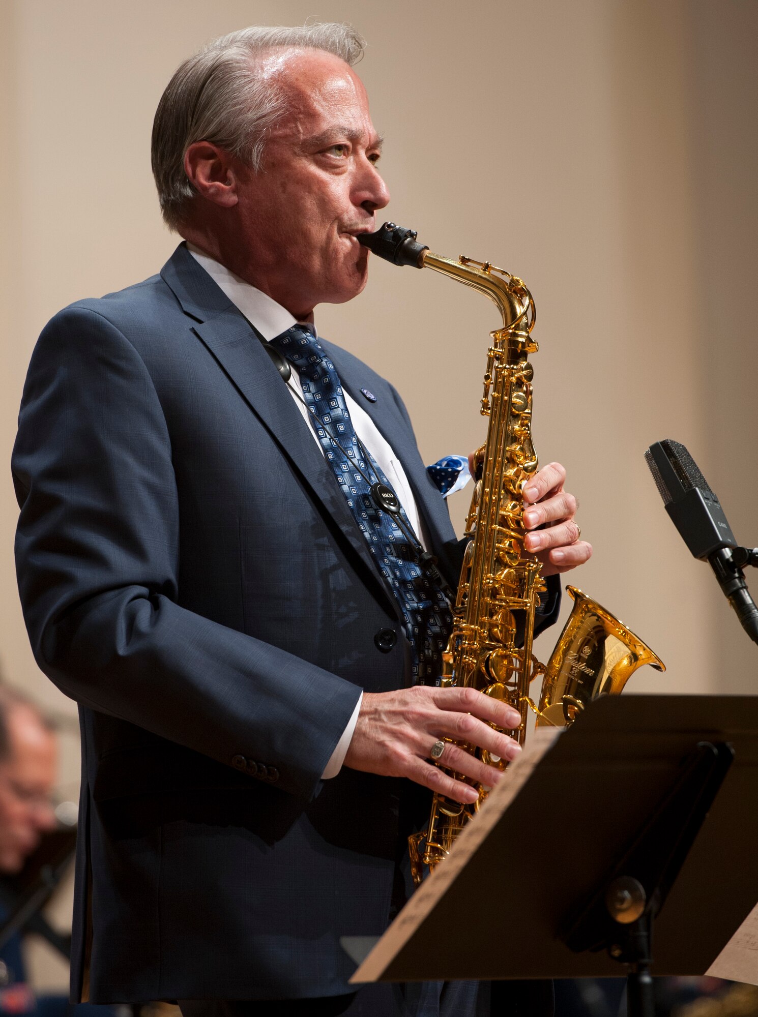 Retired Chief Master Sgt. Joe Eckert performs a solo with the Airmen of Note during a concert at Texas Christian University in Fort Worth, Texas, April 18. Eckert, who spent 20 years with the band, is now the director of the jazz program and the saxophone professor at TCU. (U.S. Air Force photo/ Tech. Sgt. James Bolinger)