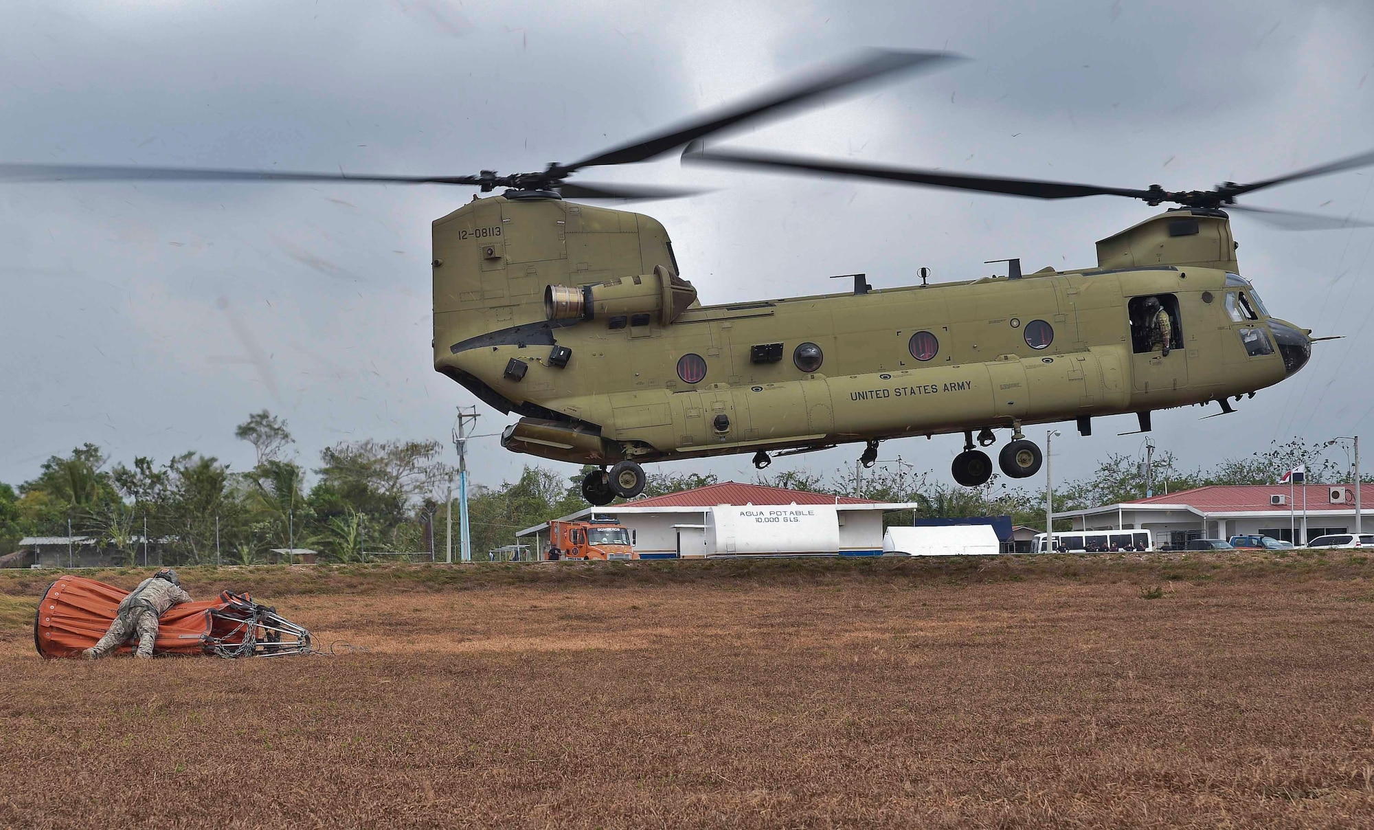 U.S. Army Staff Sgt. John Fajota, 1st Battalion, 228th Aviation Regiment CH-47 Chinook crew chief, preps a Bambi Bucket for connection to a Chinook during a firefighting operation in the Darién province of Panama, April 18, 2016. The Chinook’s Bambi Bucket can hold up to 2,000 gallons of water. (U.S. Air Force photo by Staff Sgt. Siuta B. Ika)