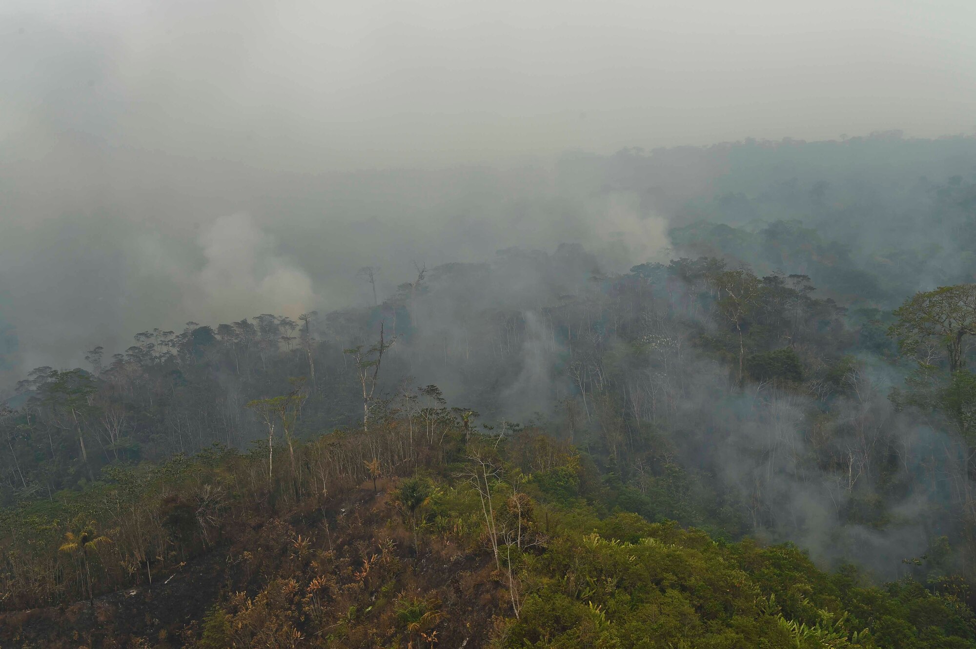 A forested area of the Darién province of Panama burns during a wildfire, April 17, 2016. This was one of many fires, which are believed to have started April 4, that grew exponentially, prompting the Government of Panama, via the U.S. Embassy in Panama, to request an aerial support package from Joint Task Force-Bravo consisting of aircraft from the 1st Battalion, 228th Aviation Regiment, Soto Cano Air Base, Honduras, to help contain the blazes. The JTF-Bravo air assets supplemented a Panamanian UH-1N Huey in the firefighting efforts. (U.S. Air Force photo by Staff Sgt. Siuta B. Ika)