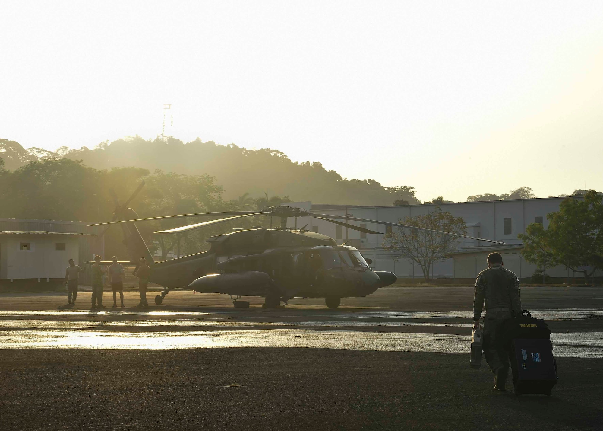 Members of the 1st Battalion, 228th Aviation Regiment, Soto Cano Air Base, Honduras, prepare a UH-60 Black Hawk helicopter for flight in the Arraiján District of Panama, April 17, 2016. The 1-228th AVN was in Panama to support Panamanian Public Forces firefighting operations in the Darién Province, where wildfires had been burning since April 4. (U.S. Air Force photo by Staff Sgt. Siuta B. Ika)