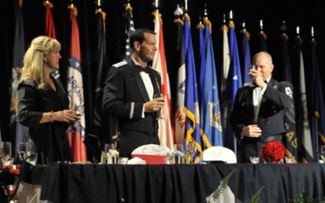 Chief Master Sgt. James W. Hotaling, the command chief master sergeant of the Air National Guard, toasts Lt. Gen. Stanley E. Clarke III, director of the Air National Guard, during his Order of the Sword induction ceremony at the Renaissance Hotel in Montgomery, Ala., April 17, 2016. Clarke is the 13th Air National Guard officer to be inducted into the Order of the Sword, which is the top honor the enlisted corps can bestow upon an officer. (U.S. Air National Guard photo by Tech. Sgt. William Buchanan/Released)