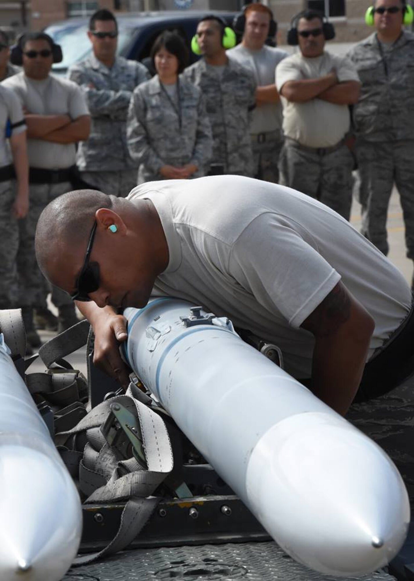 Tech. Sgt. Mark Nash, an aircraft armament systems technician, inspects an inert AIM-120, advanced medium-range air-to-air missile, as part of the loading portion of the 56th Fighter Wing’s quarterly load crew of the quarter competition at Luke Air Force Base, Arizona, April 8, 2016. Nash is a member of the Texas Air National Guard’s 149th Fighter Wing, headquartered at Joint Base San Antonio-Lackland, Texas, which is currently operating at Luke while San Antonio’s Kelly Field undergoes runway repairs. (U.S. Air National Guard photo by 2nd Lt. Phil Fountain)