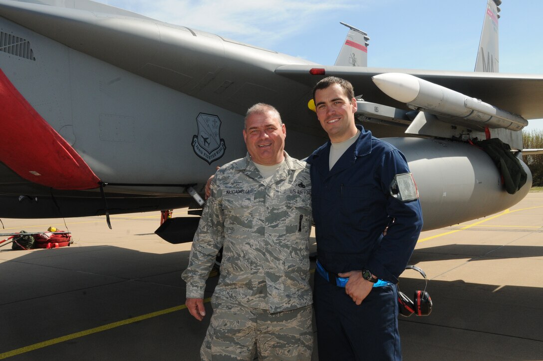 U.S. Air Force and Air National Guard Master Sgt. Donny Masciadrelli, 104th Fighter Wing avionics technician, and his son, Tech. Sgt. Danny Masciadrelli, 104th Fighter Wing F-15 crew chief, deploy together for the first time for an F-15C/D Eagle mission to the Netherlands in April 2016. They are deployed in support of Operation Atlantic Resolve along with more than 250 Airmen from the 104th as part of a theater security package, strengthening relationships and training alongside NATO allies throughout Europe. (U.S. Air National Guard photo by 1st Lt. Bonnie Harper/Released)

