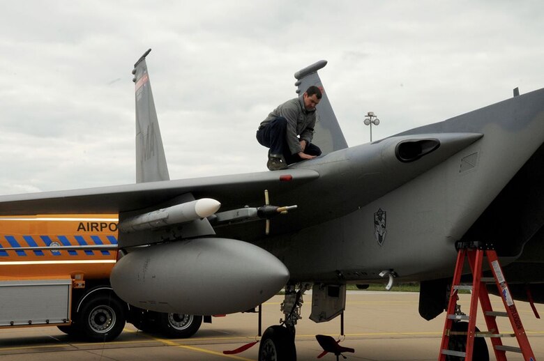 U.S. Air Force and Massachusetts Air National Guard Tech. Sgt. Daniel Masciadrelli, 104th Maintenance Squadron, conducts a visual inspection of the top of a U.S. Air Force F-15C Eagle aircraft after being flown April 18, 2016, during exercise Frisian Flag at Leeuwarden Air Base, Netherlands. The F-15s will conduct training with more than 70 aircraft from the Netherlands, Australia, Belgium, Finland, France, Germany, Poland, Norway, and the United Kingdom during Frisian Flag 2016 at Leeuwarden, April 11-22, 2016. (U.S. Air National Guard photo by 1st Lt. Bonnie Harper/Released)
