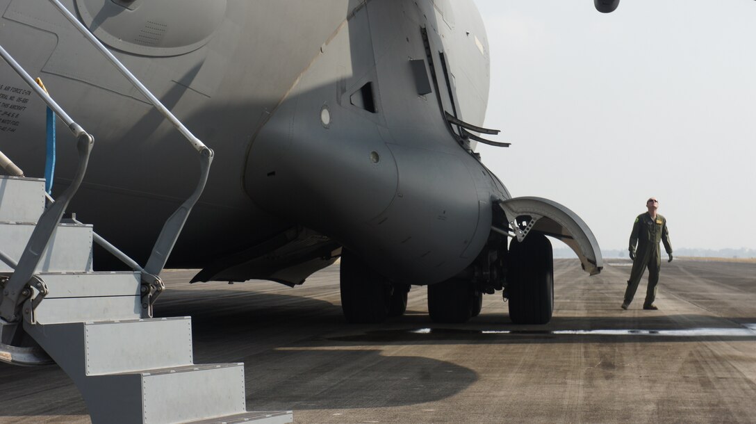 U.S. Air Force Capt. David Foster with the 535th Airlift squadron conducts a preflight check on a C-17 Globemaster III during exercise Balikatan 2016, Clark Air Filed, Philippines, April 15, 2016. Balikatan, which means shoulder to shoulder in Filipino, is an annual bilateral training exercise aimed at improving the ability of Philippine and U.S. military forces to work together during planning, contingency and humanitarian assistance and disaster relief operations. (U.S. Air National Guard photo by Tech. Sgt. Andrew Jackson/released)
